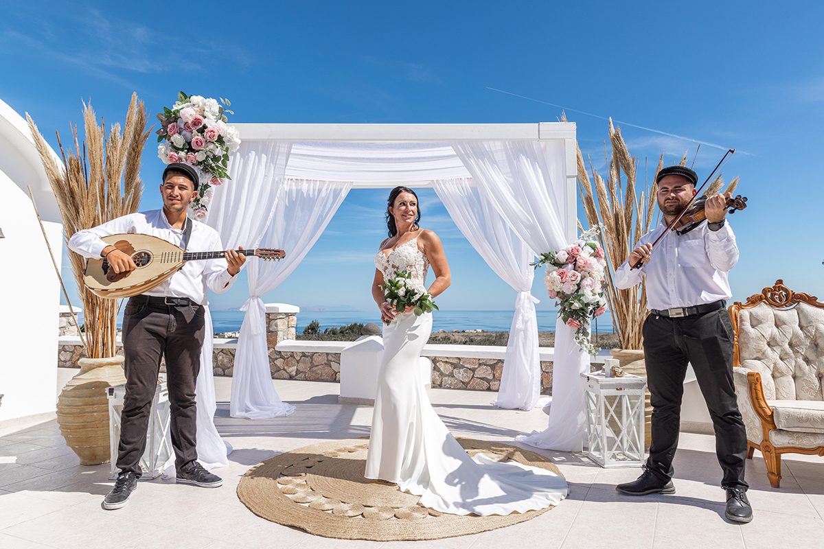 Traditional Greek musicians playing at a chapel ceremony