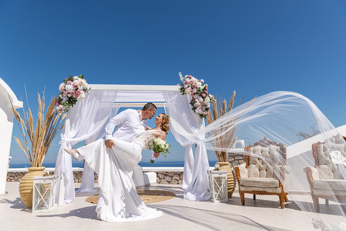 White draped gazebo dressed for a Santorini wedding ceremony