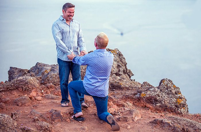 Marriage proposal on the volcanic cliffs of Santorini