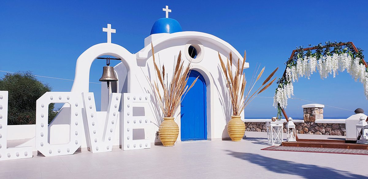 Chapel courtyard dressed with LOVE letters and pampas grass