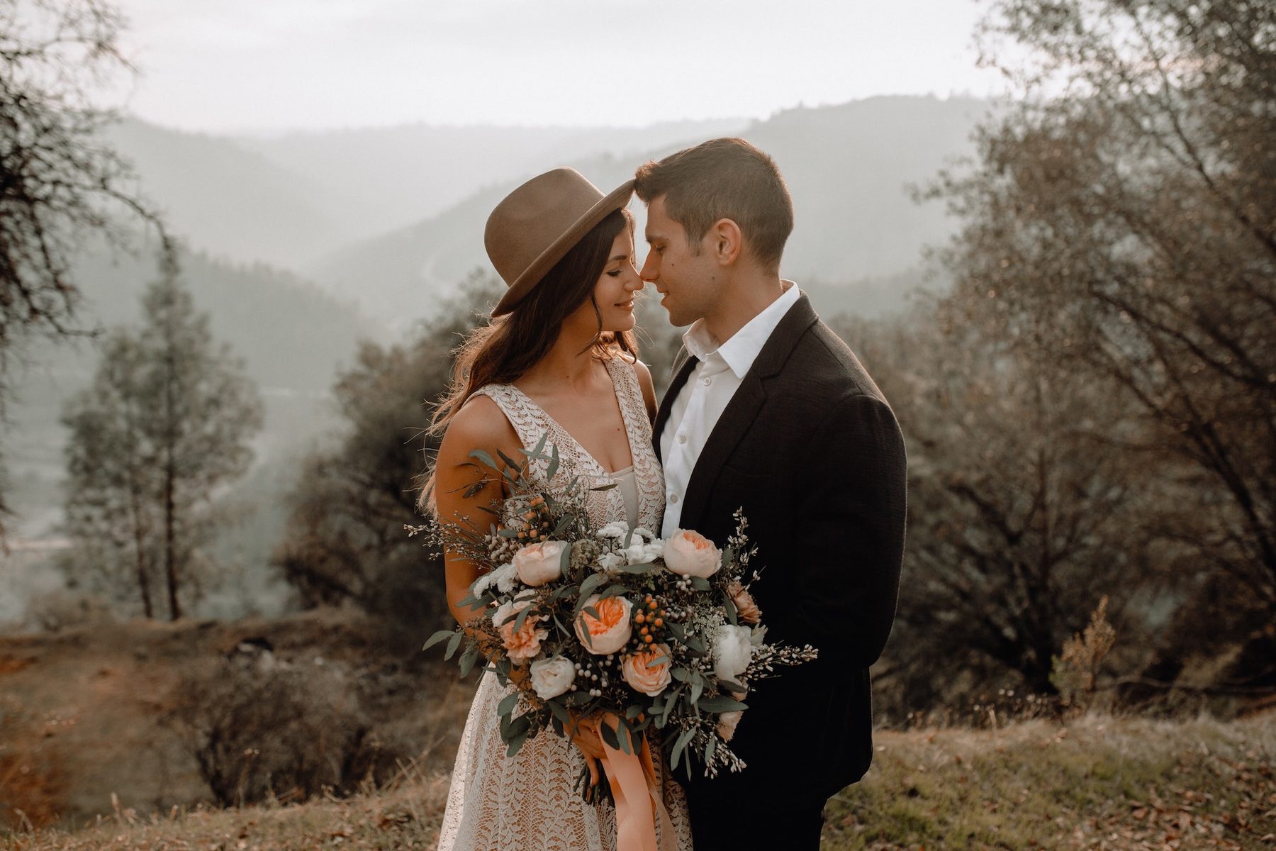 Couple eloping in Santorini, photographed together in an open landscape