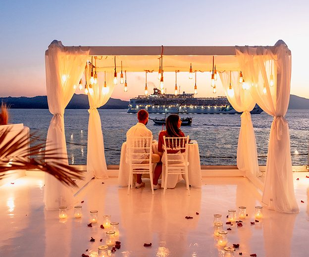 Candlelit gazebo dinner at Aion Santorini at sunset