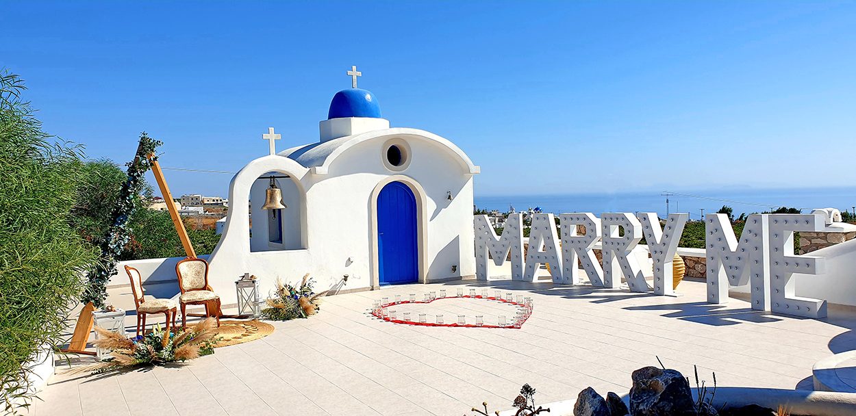 Greek Orthodox priest conducting a wedding ceremony in a Santorini church