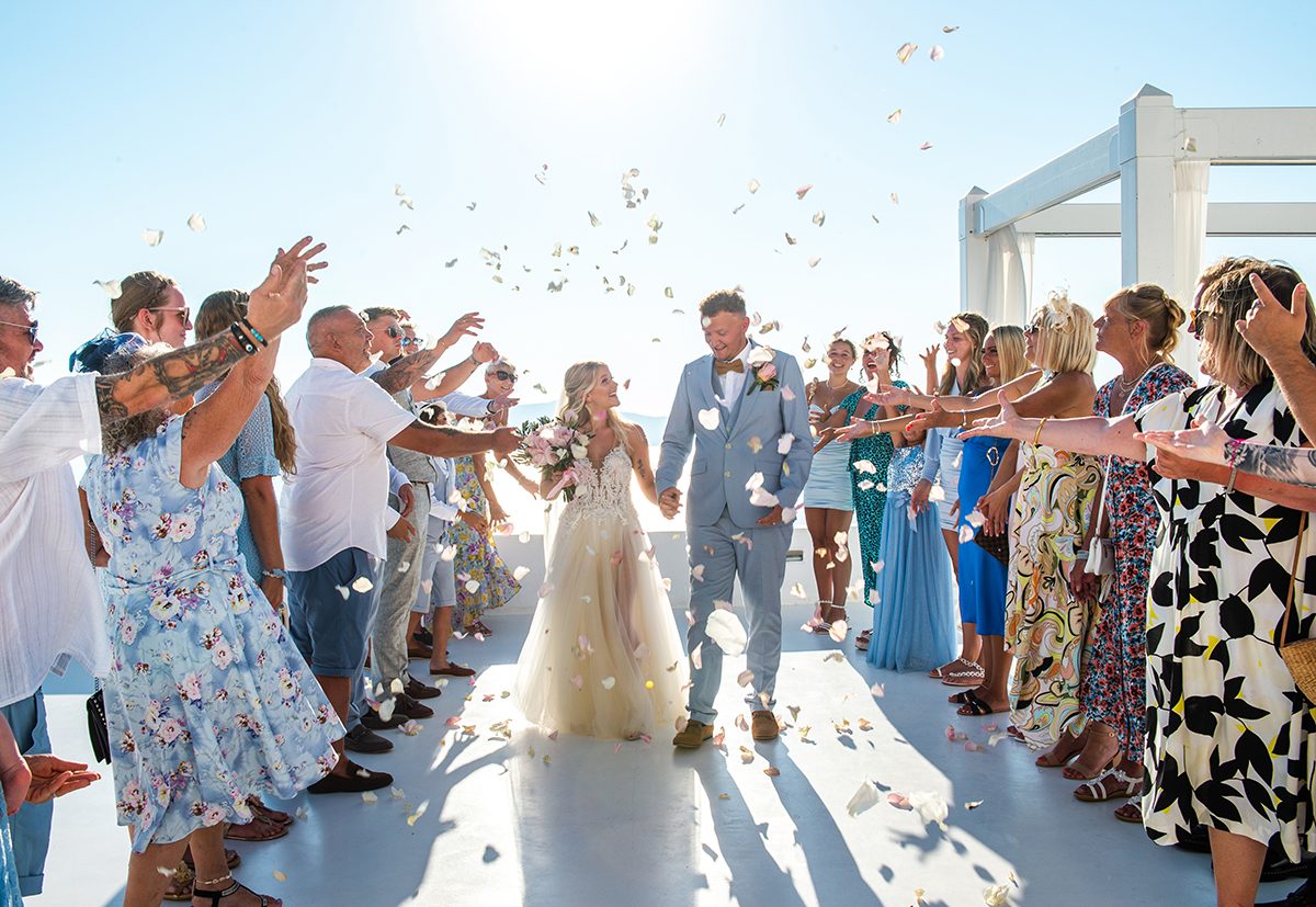 Confetti thrown over the couple as they leave the ceremony