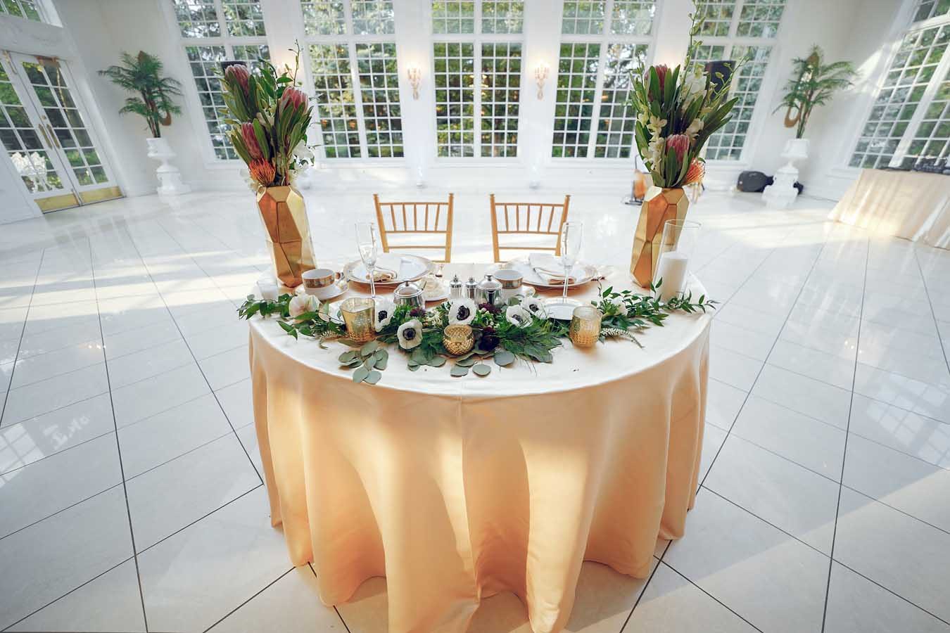 Gold table setting for a wedding reception