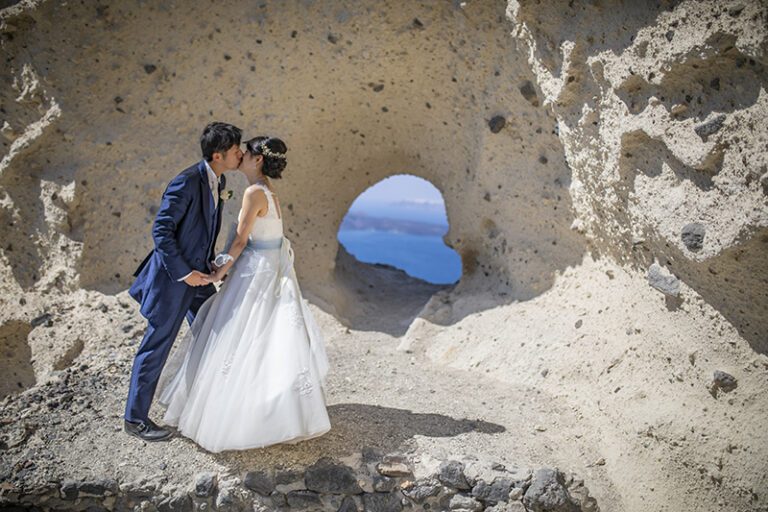 Couple photographed on the black volcanic rocks
