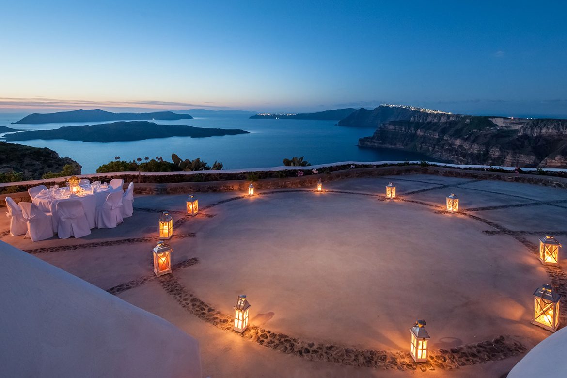 Private dinner proposal setup with candles at Aion Santorini