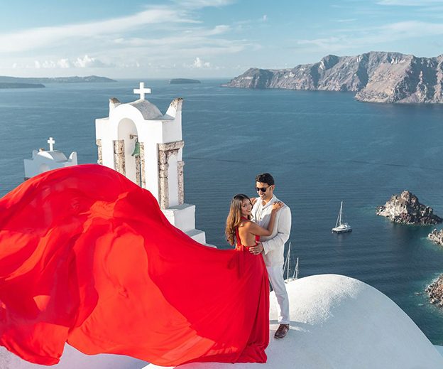 Flying dress proposal photo shoot in Santorini