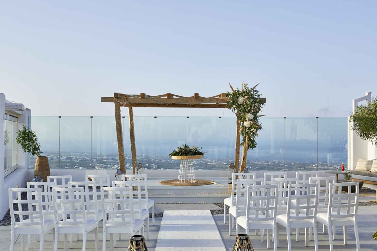 Reception venue set with tables above the caldera