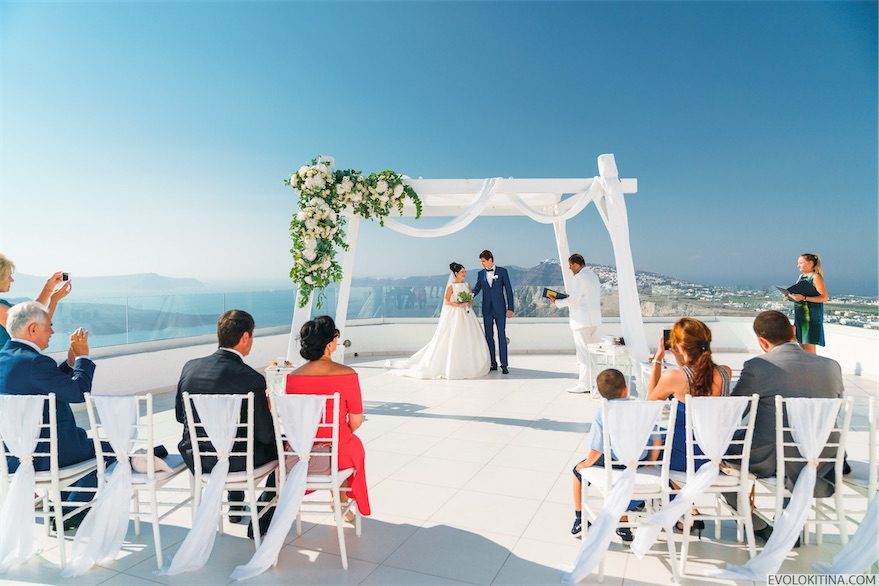 Wedding ceremony at Santo Winery with guests seated on the terrace
