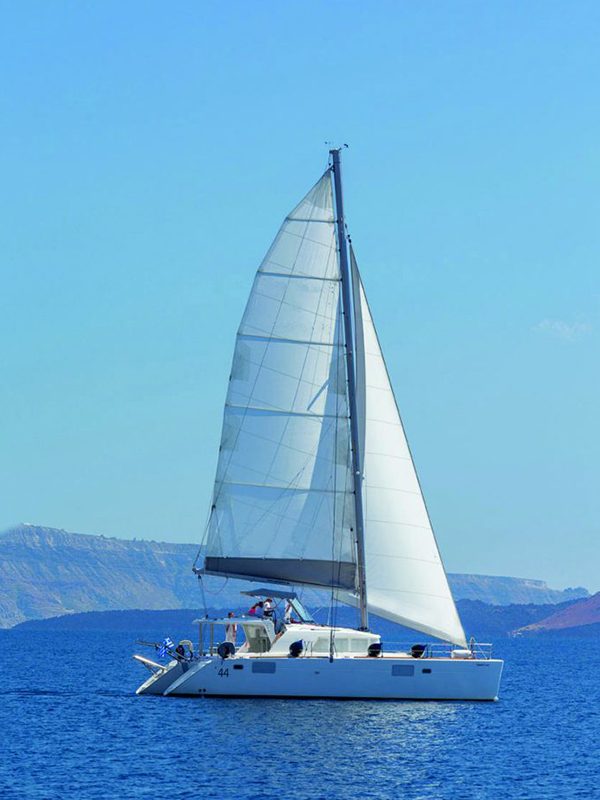 Lagoon catamaran sailing the Santorini caldera