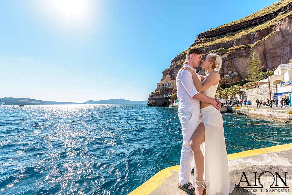 Aion Santorini venue gazebo dressed in white above the caldera at sunset