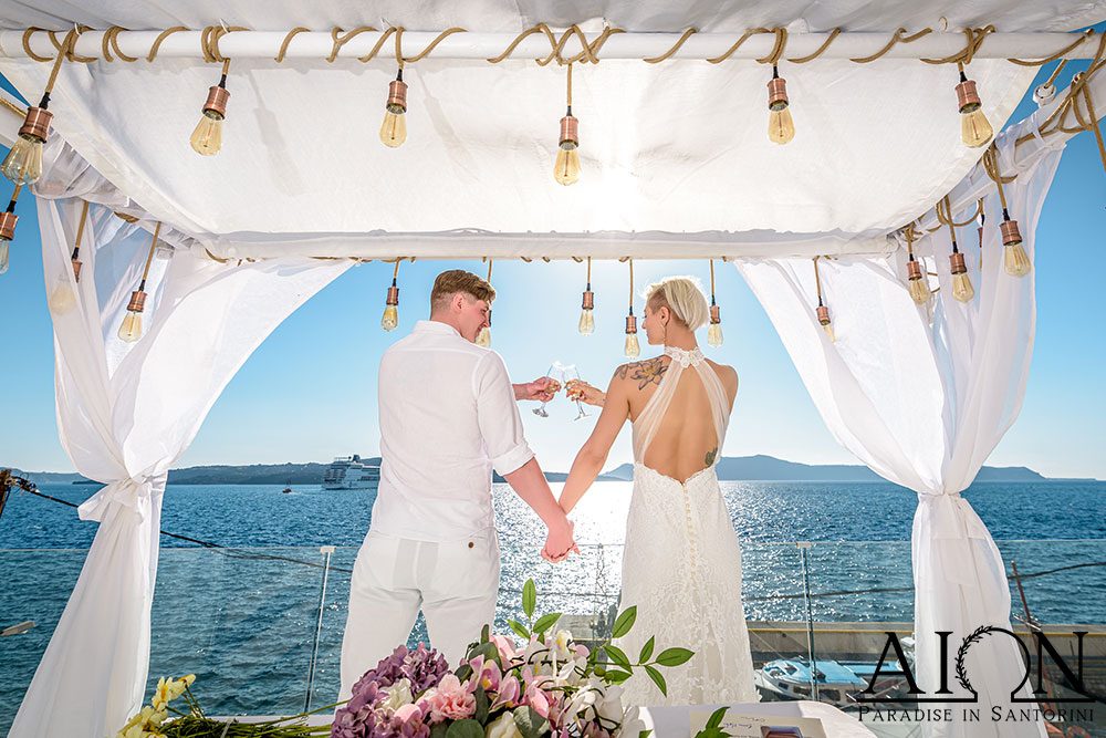 Couple beneath the Aion gazebo at sunset