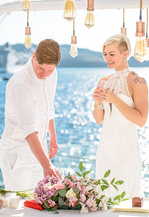 Couple at Aion beneath the hanging lights