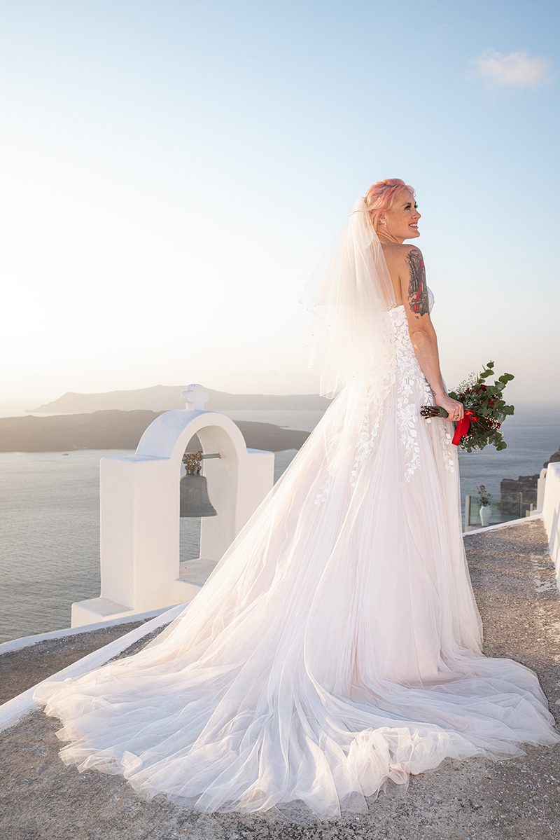 Symbolic wedding ceremony set up on a Santorini terrace above the volcano