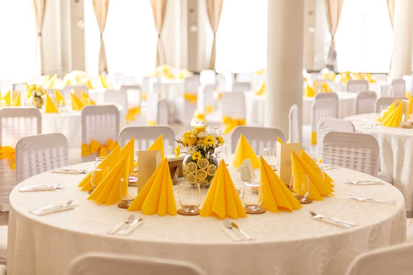 Reception tables laid for a wedding dinner