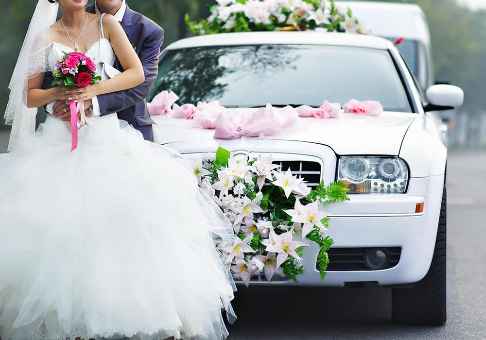 Mercedes bridal car decorated with flowers
