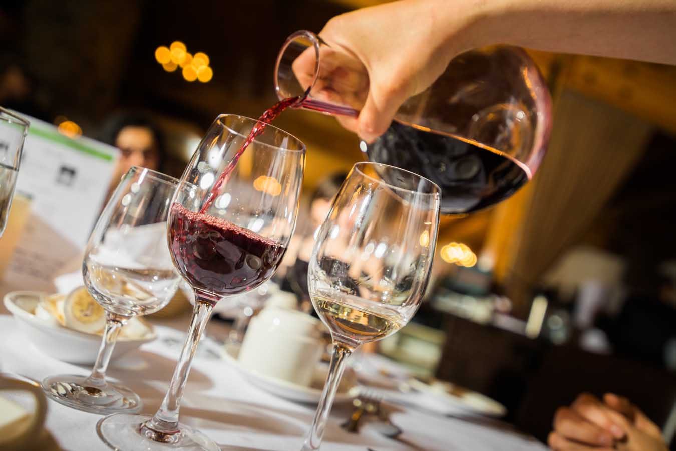 Wine poured at a Santorini wedding reception
